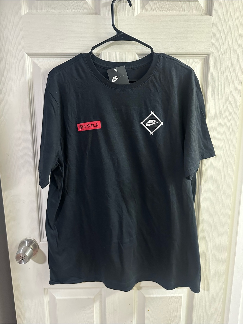 Nike Black Short Sleeve Tee with White Logo and Red Patch